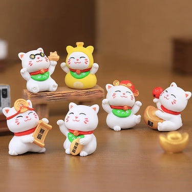 The Luxury Golden Fortune Cat Collection by KittyNook Cat Co. features six small cats in various lucky poses for décor.